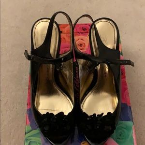 Black open toe, sling back shoes.